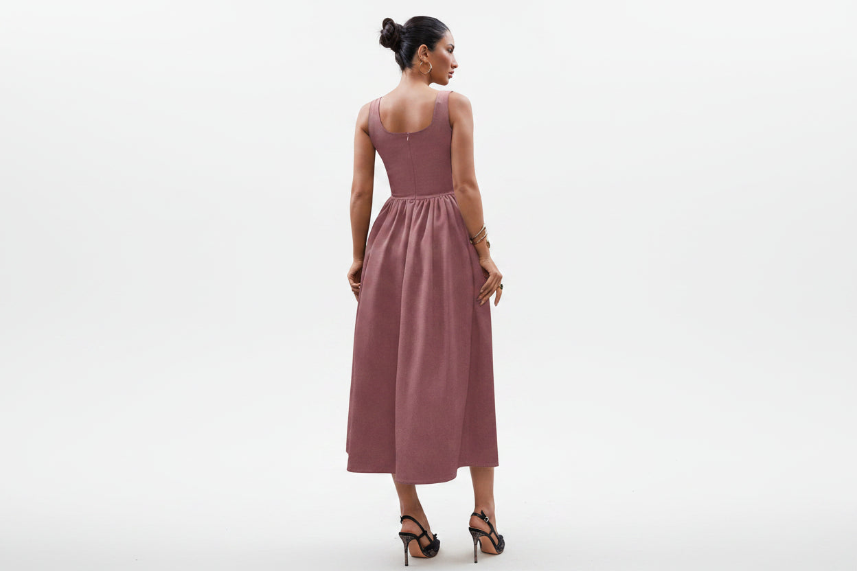 woman wearing a blush rose elegant maxi dress
