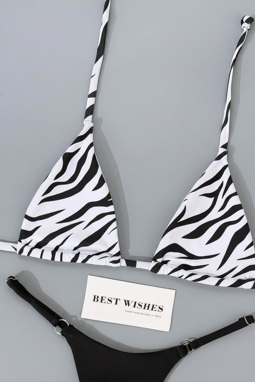detail view of women´s swimwear in black and white and animal prints
