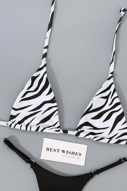 detail view of women´s swimwear in black and white and animal prints