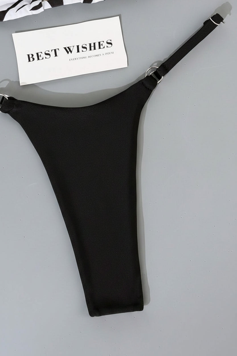 detail view of women´s swimwear in black and white and animal prints 