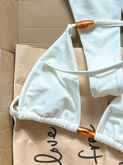 detail view of women´s swimwear in creamy white