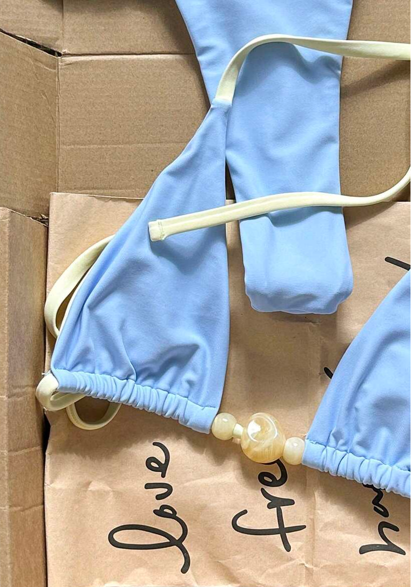 detail view of women´s light blue two-piece bikini set