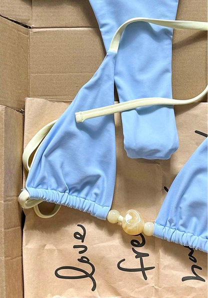 detail view of women´s light blue two-piece bikini set