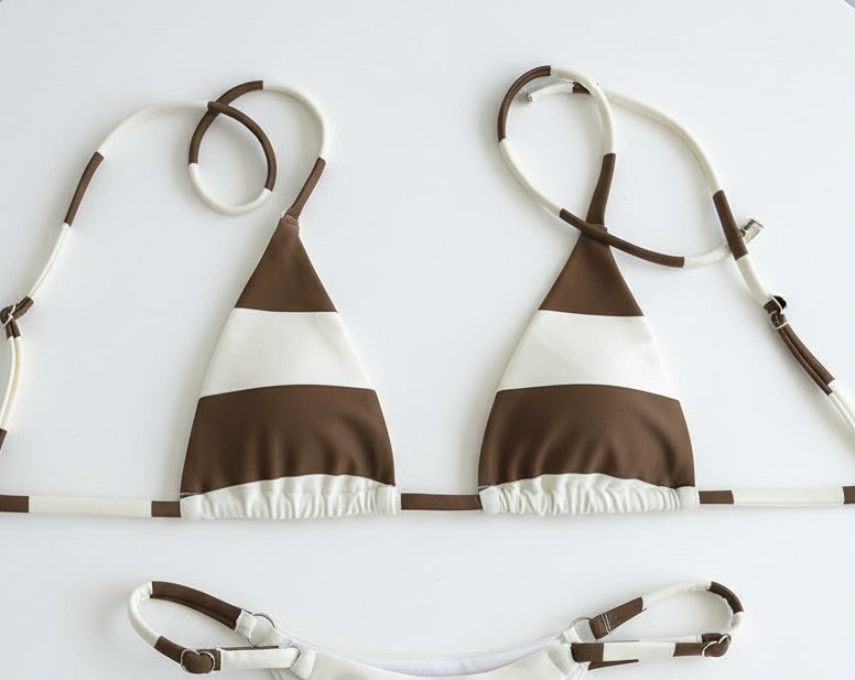 detail view of women´s swimwear in white and cocoa colors 