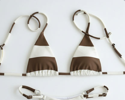 detail view of women´s swimwear in white and cocoa colors 
