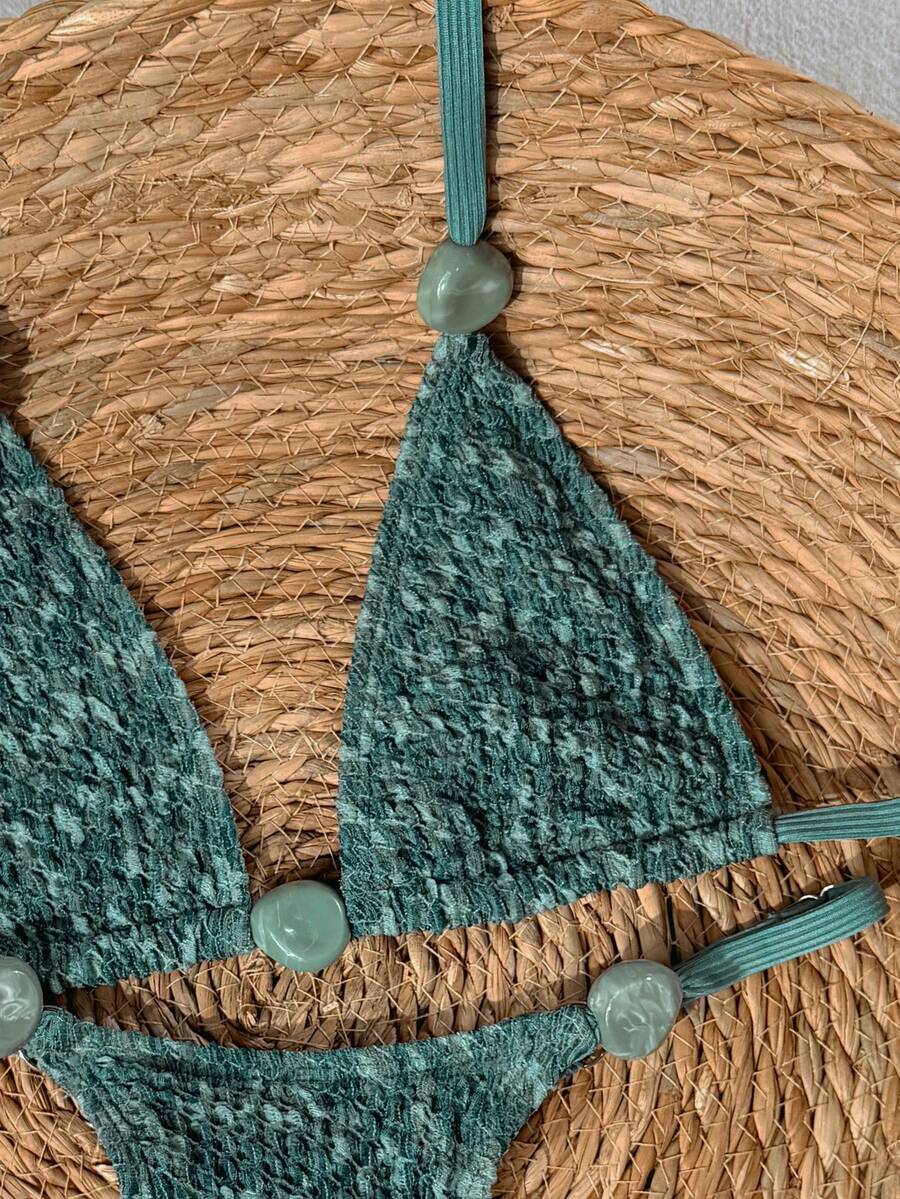 detail view of women´s two-piece swimwear in green