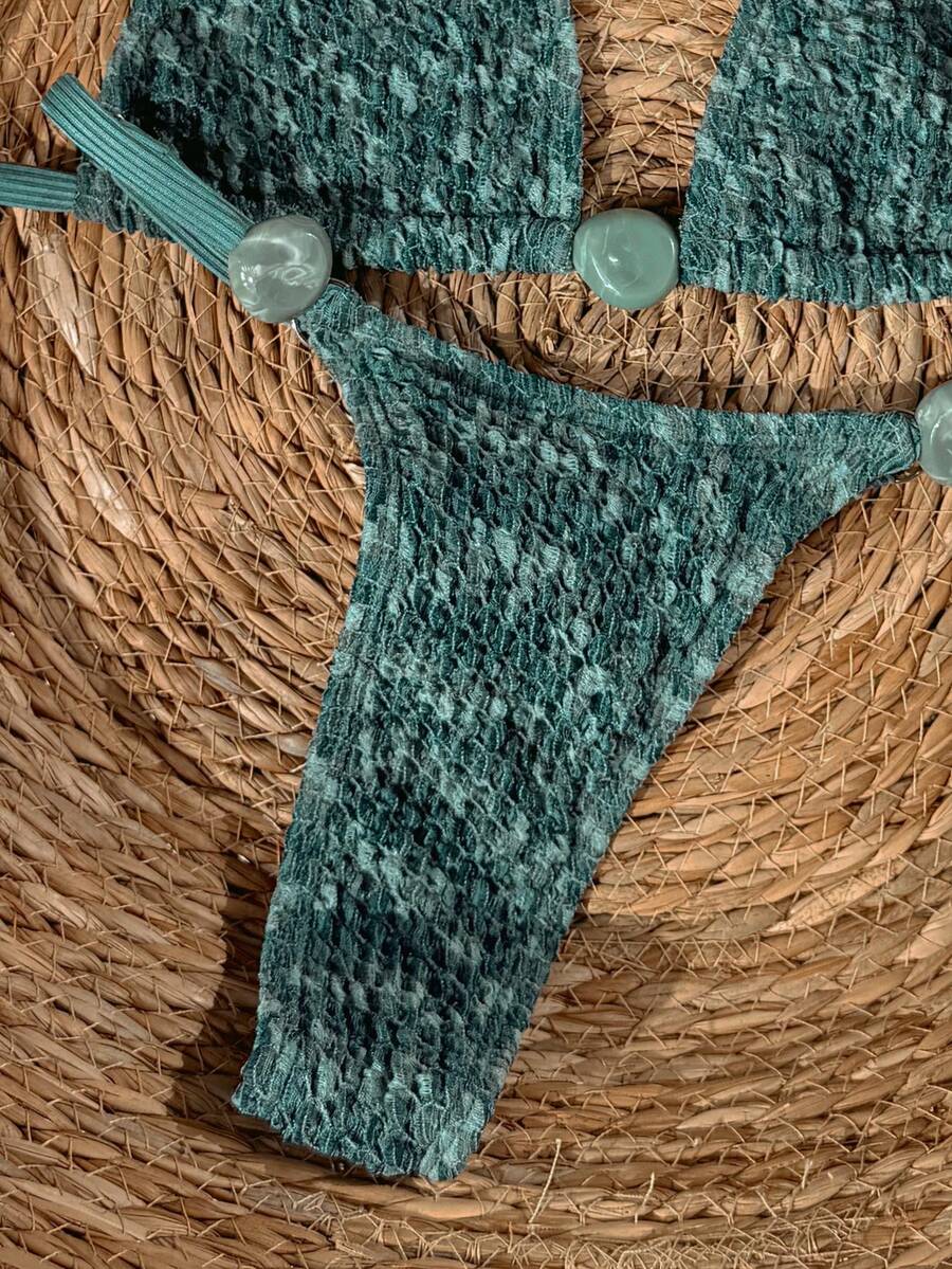 detail view of women´s swimwear in green