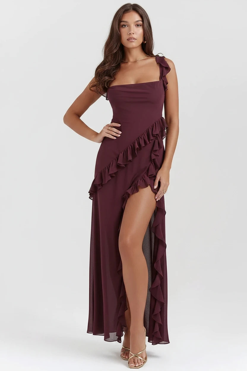 Woman wearing luxury black/burgundy slit maxi dress 