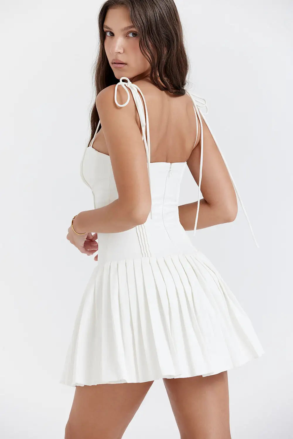 woman wearing white pleated mini midi dress 