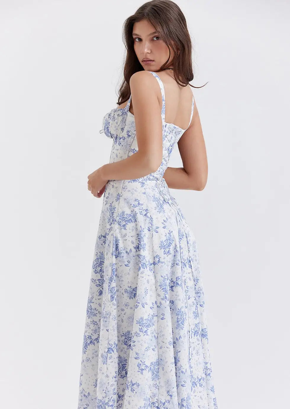 woman wearing a summer floral aesthetic blue and white dress
