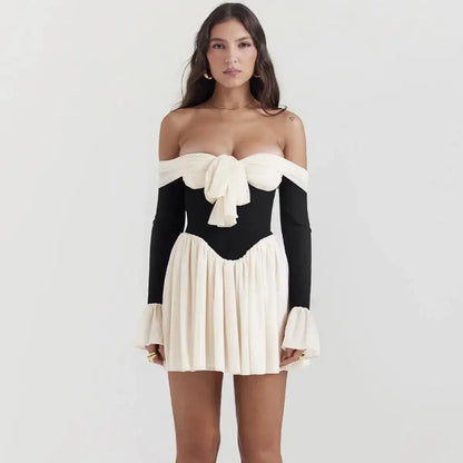 woman wearing a black and white mini dress