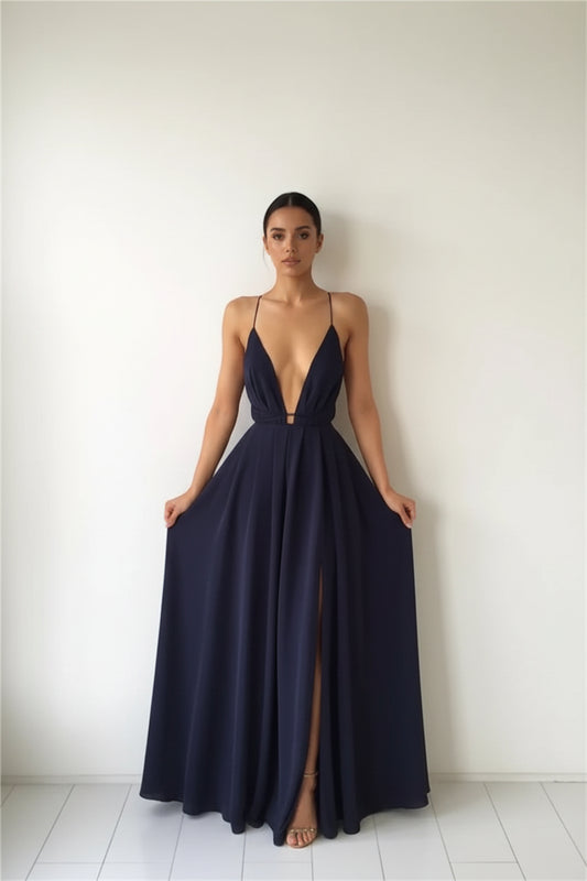 woman wearing navy blue backless maxi dress with plunging neckline