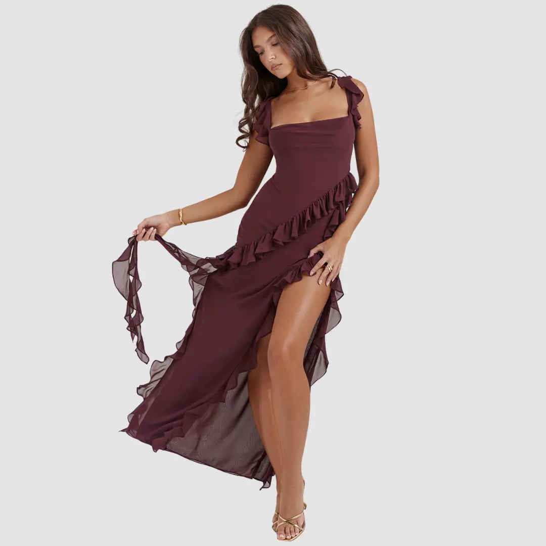 Woman wearing a burgundy dress with ruffled details