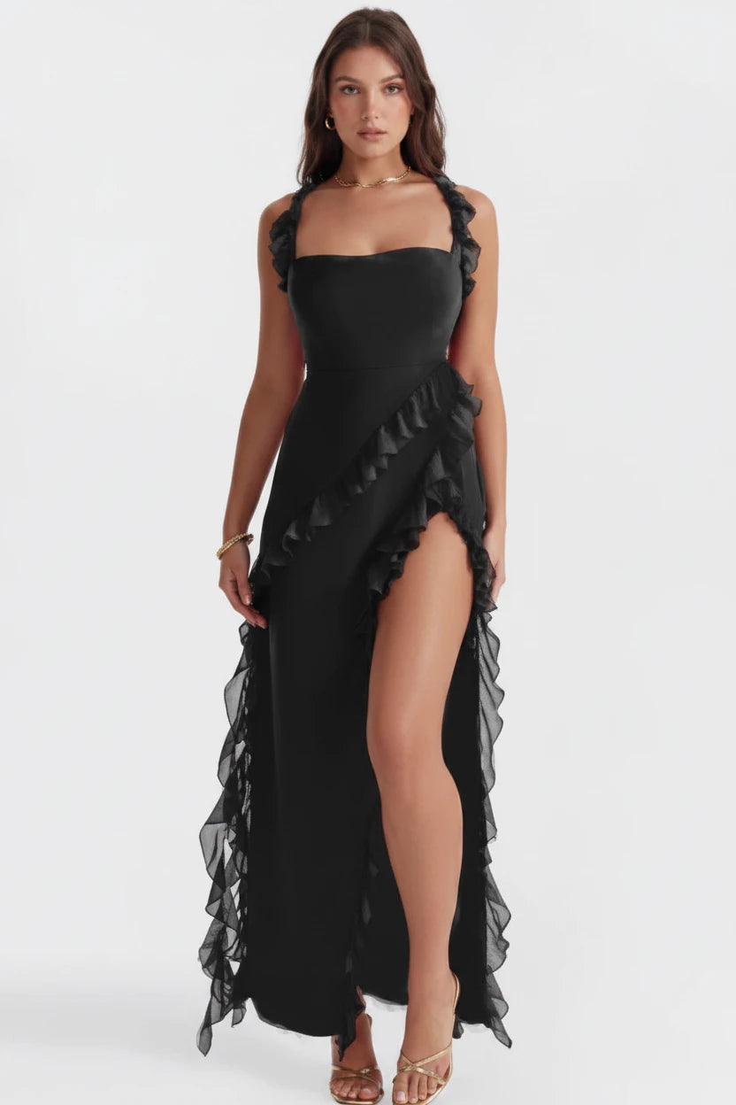 Woman wearing luxury black slit maxi dress 