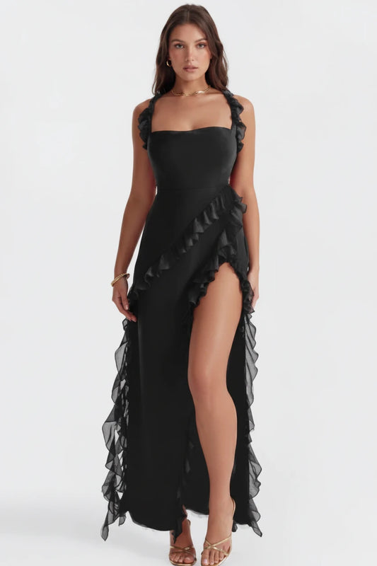 Woman wearing luxury black slit maxi dress 