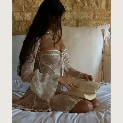 white lace mini dress styled for an evening occasion