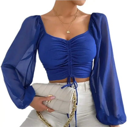 blue drawstring crop top with sheer bishop sleeves