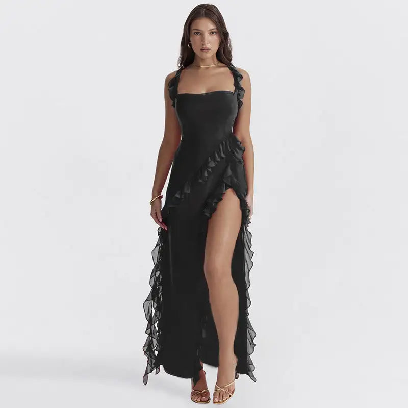 Woman wearing a black dress with ruffled details 