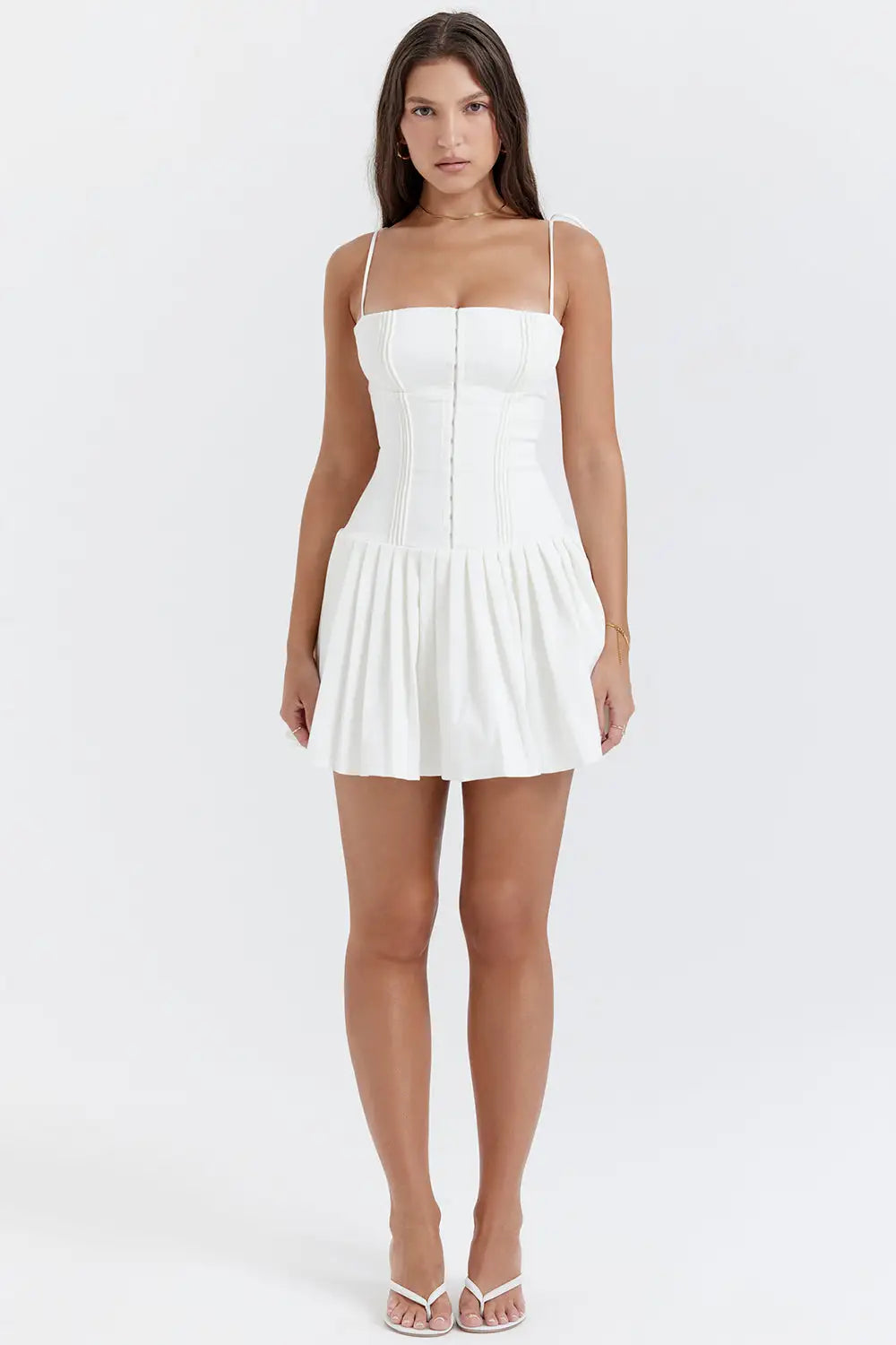 woman wearing white pleated mini midi dress 